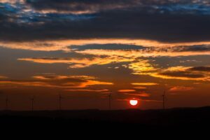 sunset, sun, pinwheels, clouds, forest, afterglow, evening sky, evening sun, heaven, horizon, orange, nature, play of colors, evening atmosphere, silence, quiet, wind energy, wind power, renewable energy, environmentally friendly, wind turbine, nature, quiet, wind power, renewable energy, renewable energy, renewable energy, renewable energy, renewable energy, wind turbine, wind turbine, wind turbine
