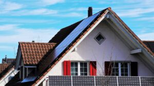 the roof of the, house, the window, shutters, red, architecture, sky, family, blue sky, building, no one, outside, the structure of the, modern, on the roof, under the roof, roof plate, roofing, window, covering, building and construction, small building, village, wooden window, nature, style, aesthetically pleasing, solar panels, solar batteries