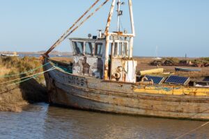 working boat, fishing boat, nature, sea, water, solar panel, photovoltaic panel, old meets new