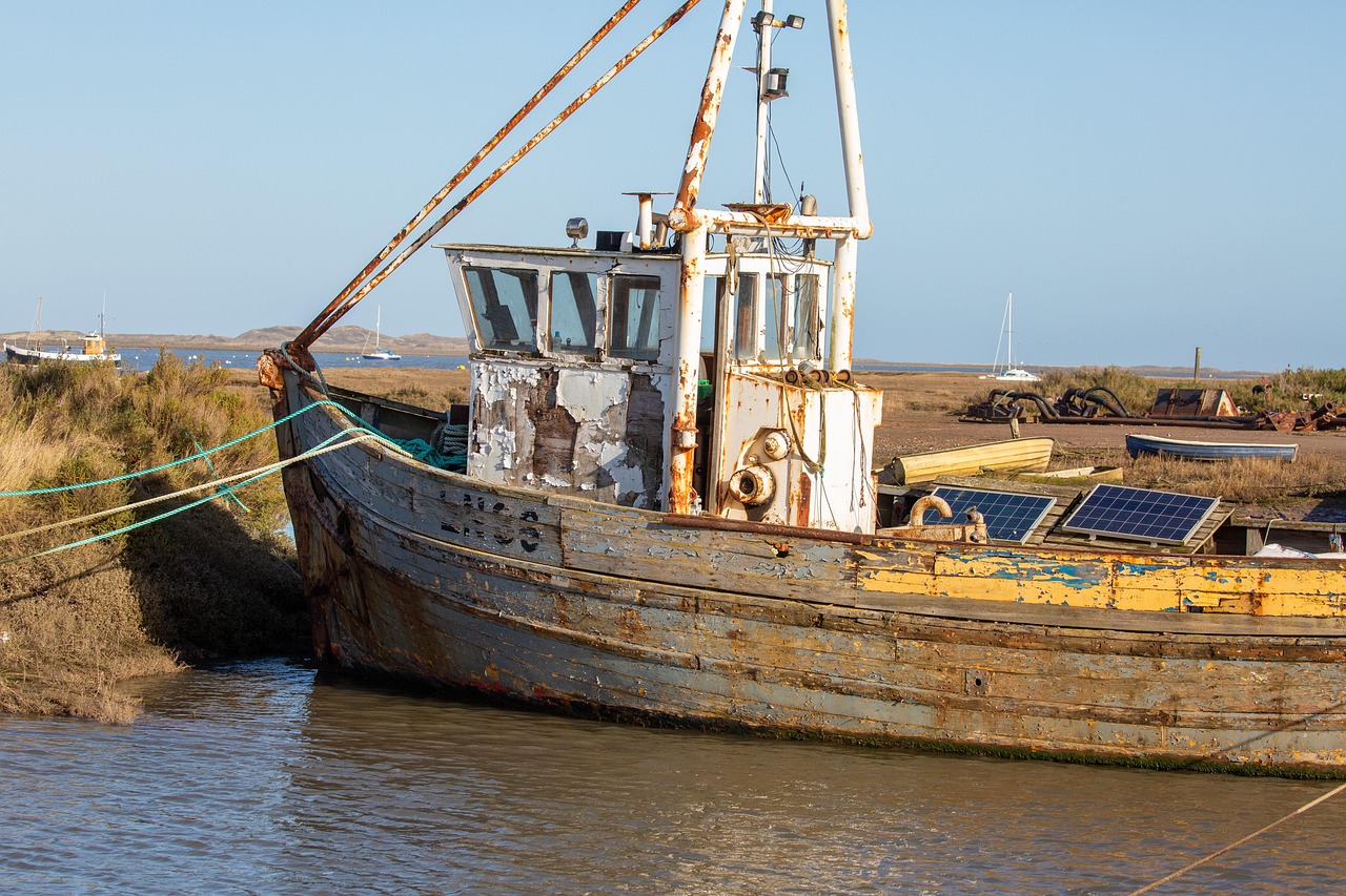 working boat, fishing boat, nature, sea, water, solar panel, photovoltaic panel, old meets new
