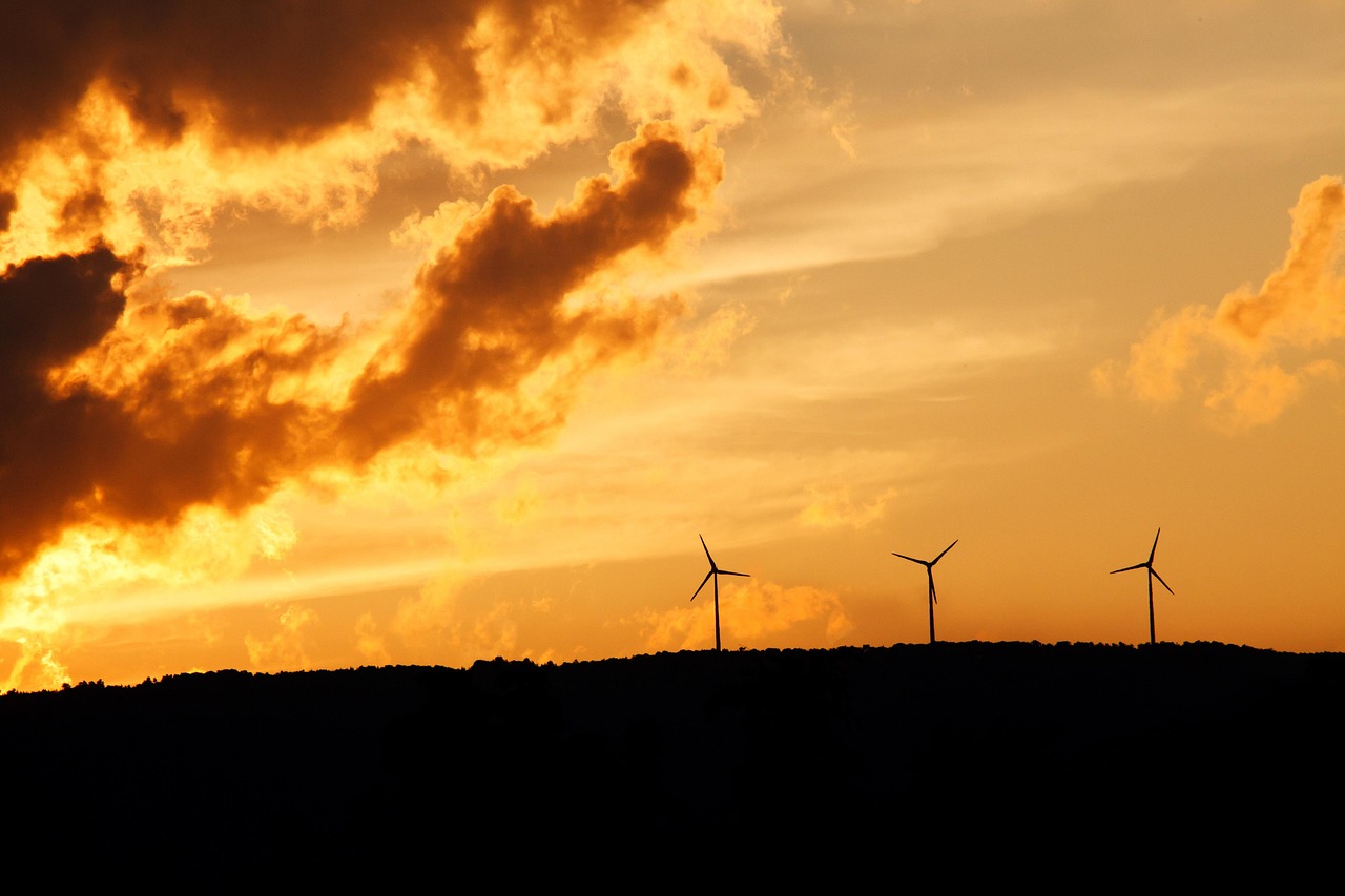 alternative, clean, cloud, electricity, energy, environment, environmental, generator, nature, horizon, power, renewable, silhouette, sunset, sustainable, technology, turbine, wind, orange technology, orange sunset, orange clouds, orange energy, orange power, orange clean